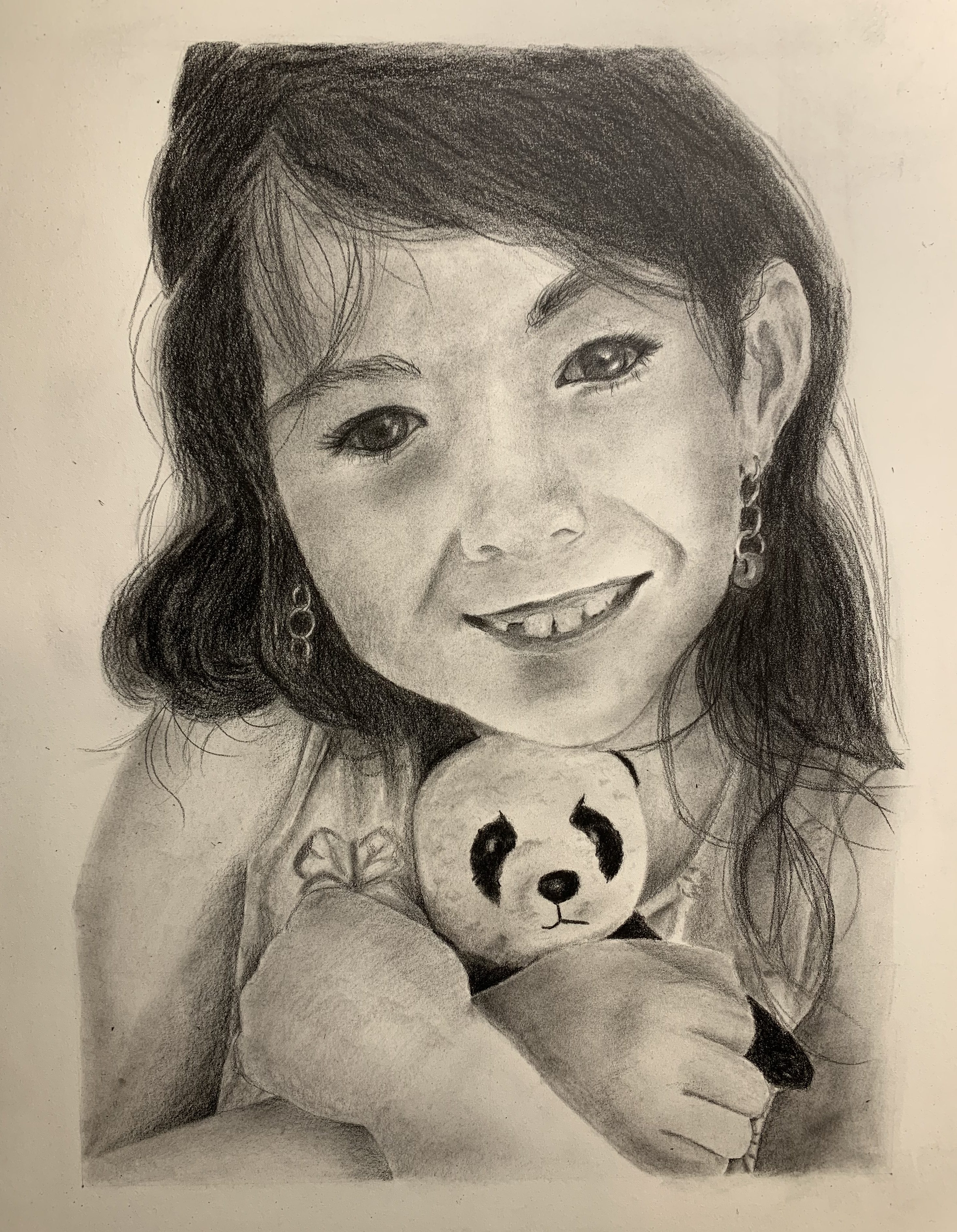 Drawing of young girl holding stuffed panda.